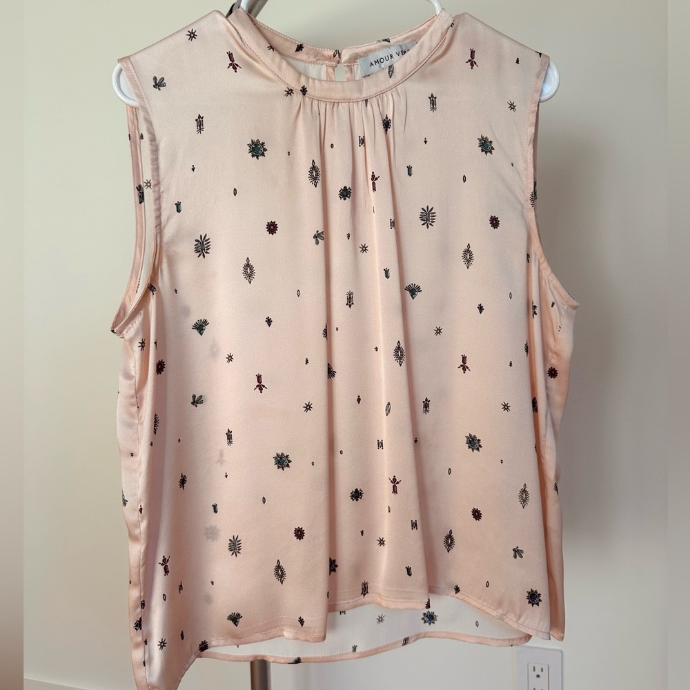 Amour Vert sleeveless pink blouse with gem stone prints in shades of turquoise.